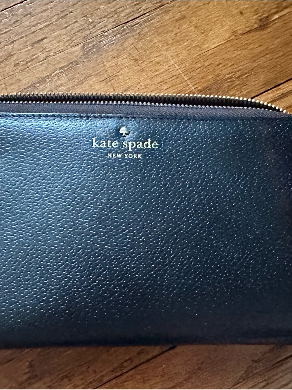 kate spade black pebbled leather zip-around wallet with gold logo